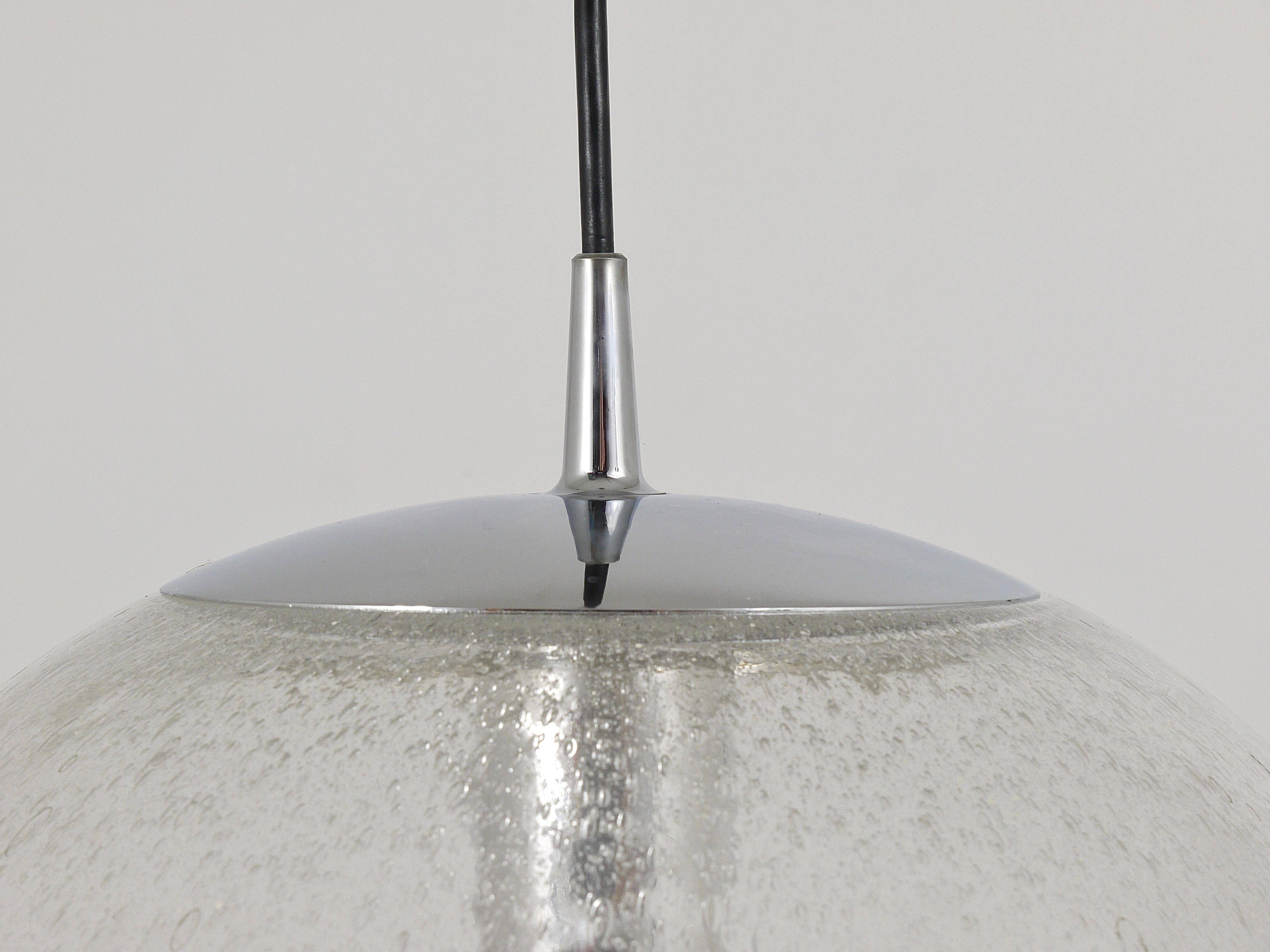 Large glass globe pendant light with bubbles and chrome by Peil & Putzler, Germany, 1970s.
