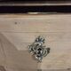 Stripped chest of drawers with bronze handles
