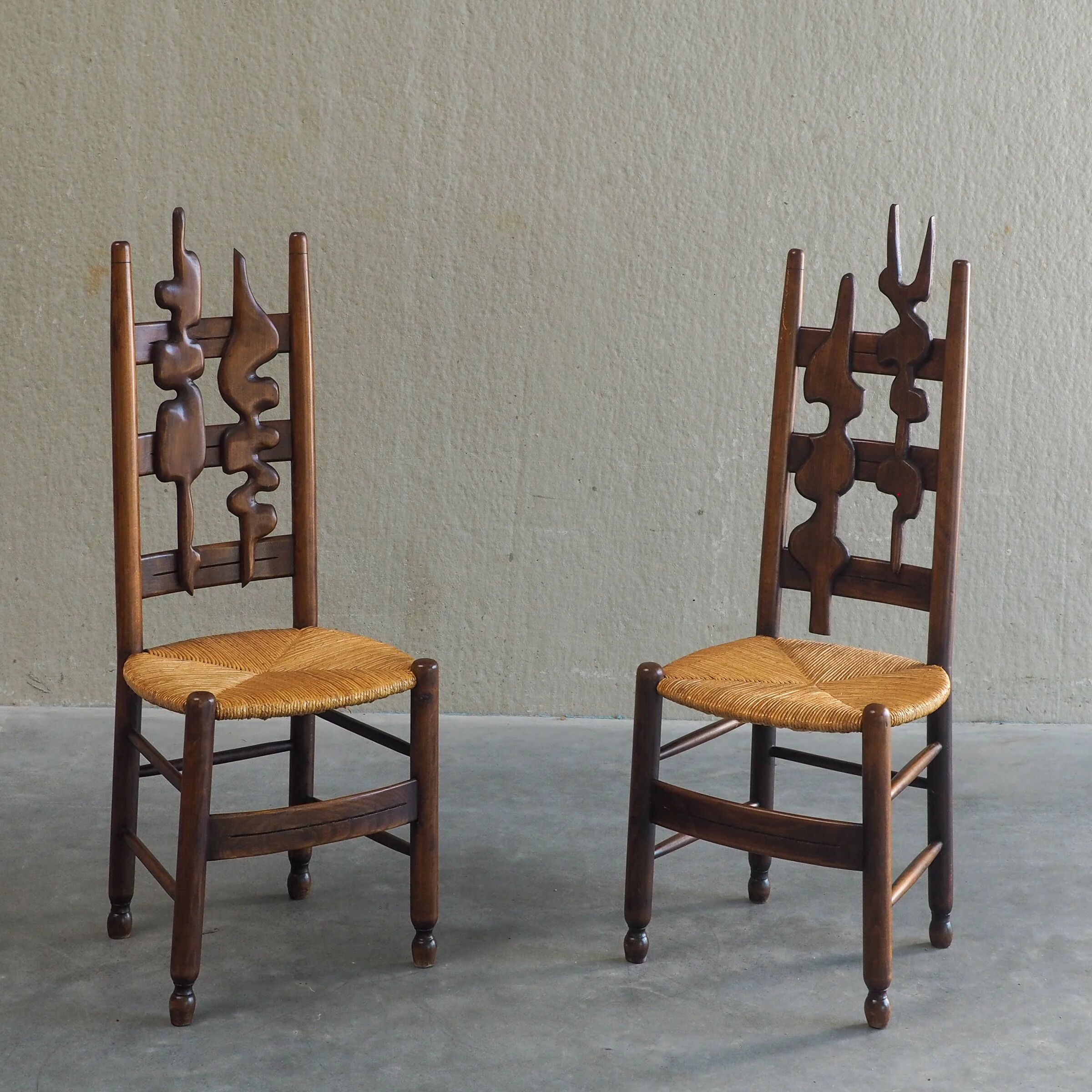2 sculptural brutalist high-back chairs