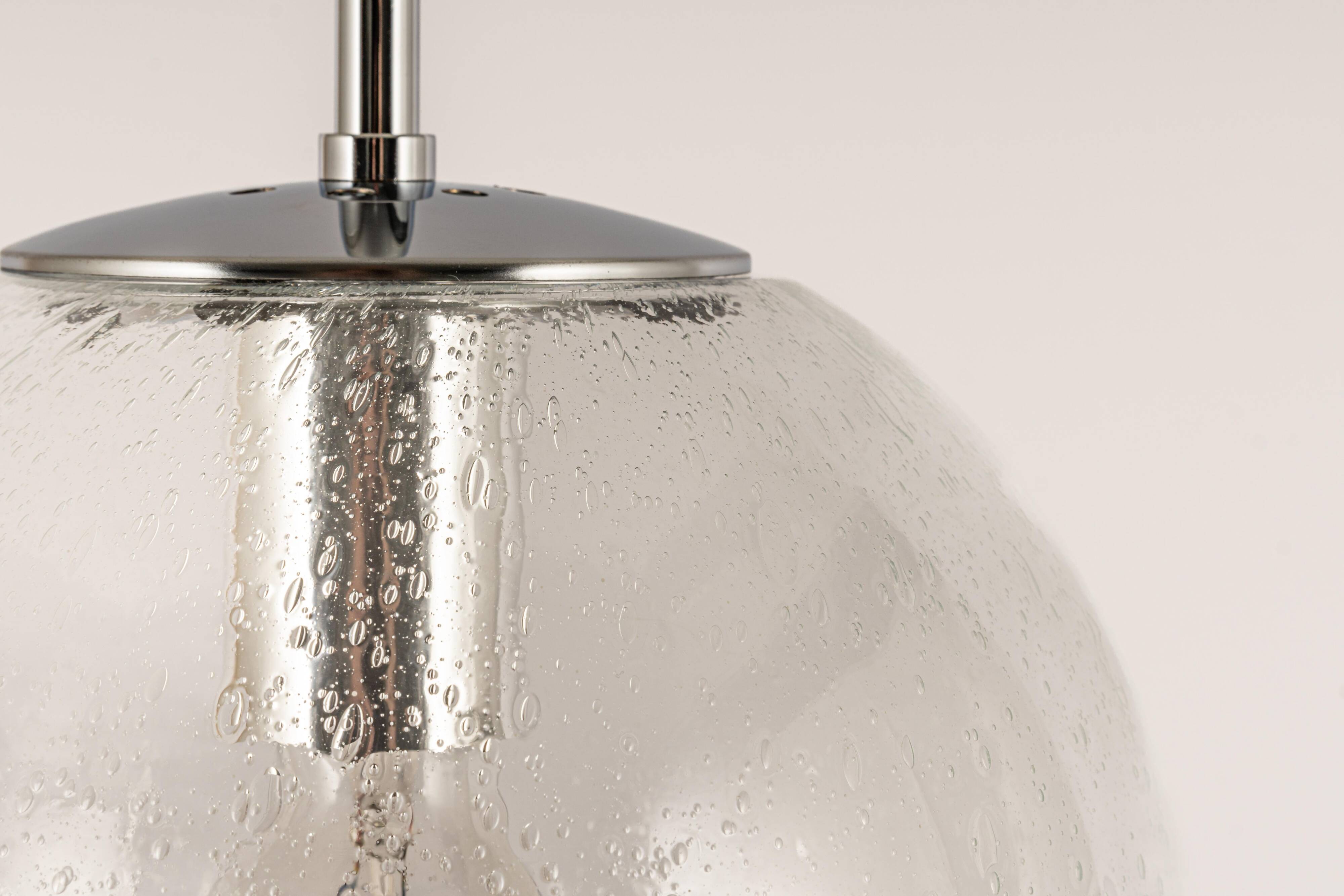 Small Limburg chrome pendant light with clear glass globe, Germany, 1970s.
