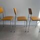 LM vintage chrome and orange/mustard yellow faux leather chairs