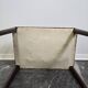 Vintage wooden ottoman from the 1940s with a silk top and studded trim.