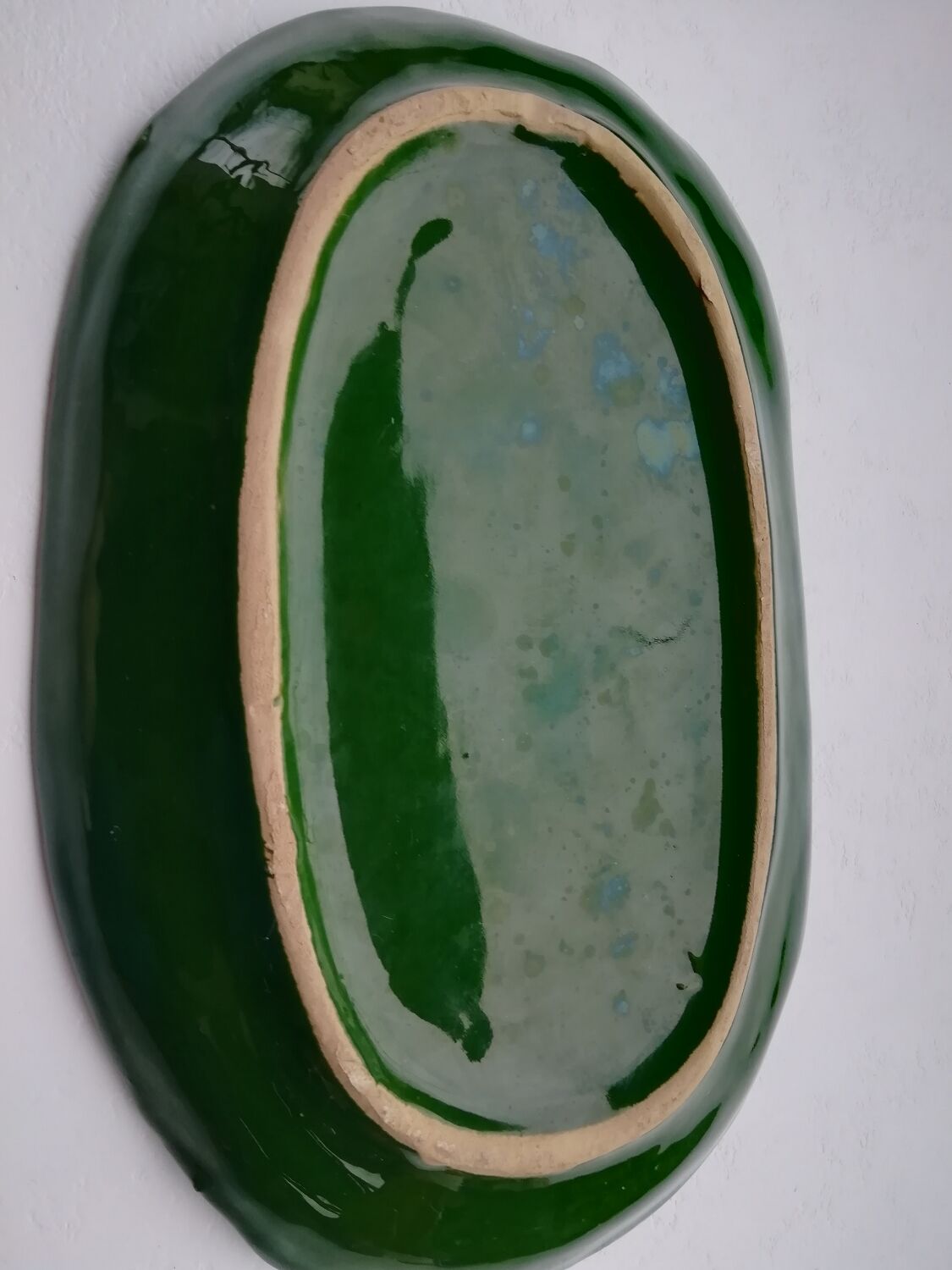 Oval flat decoration in relief