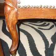 Armchair and its footrest