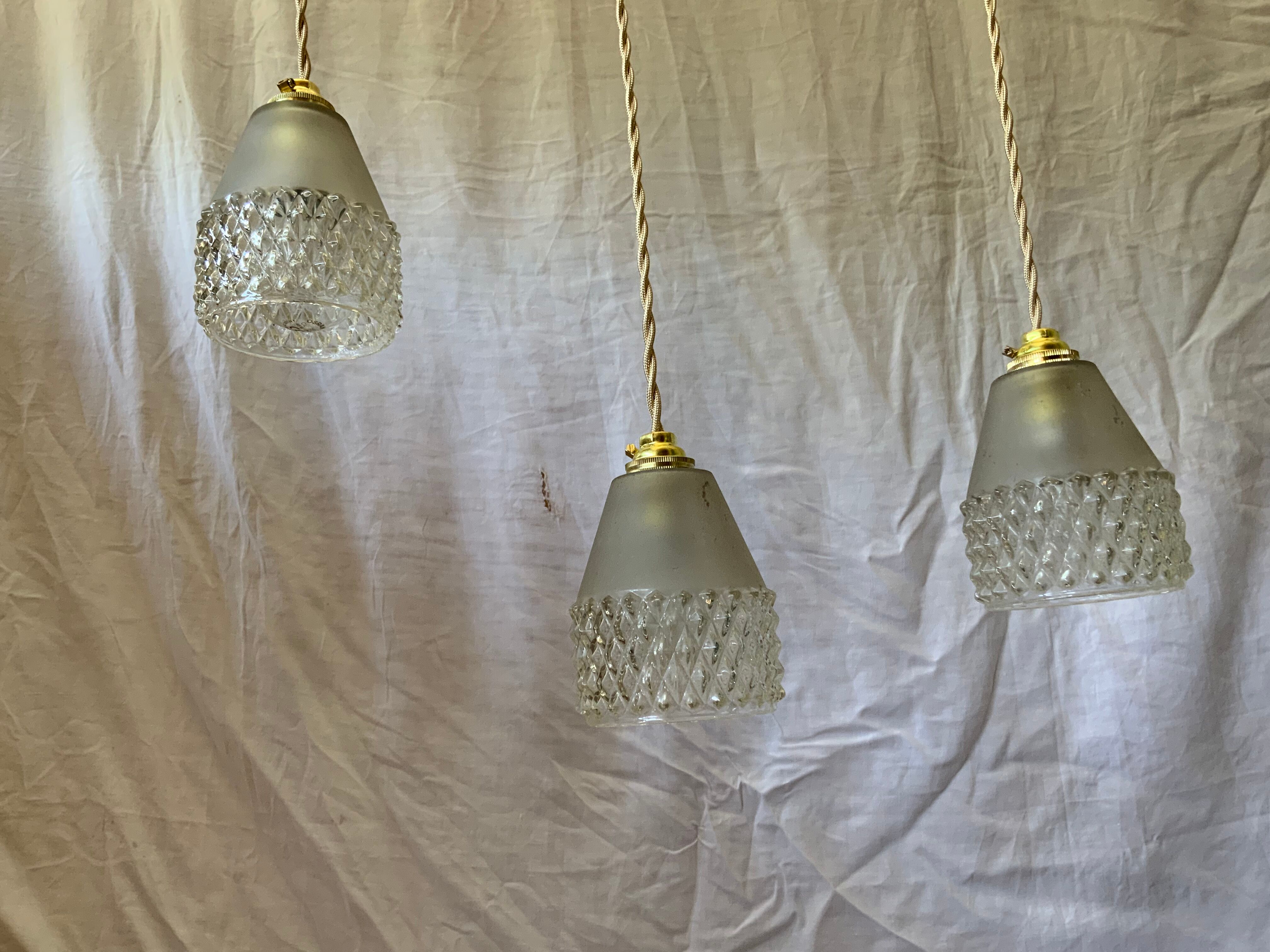 Trio of vintage suspensions