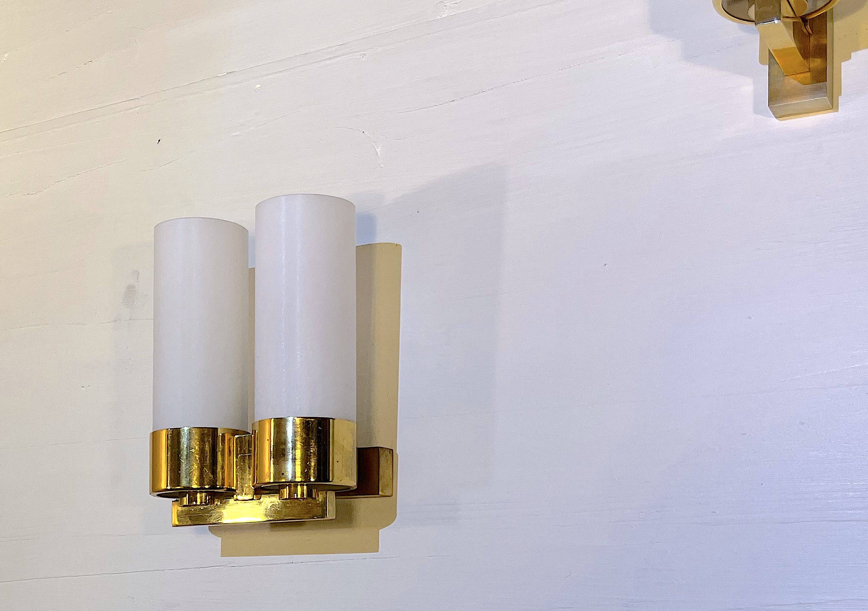 Set of three brass and opaline sconces, mid-century France