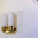 Set of three brass and opaline sconces, mid-century France