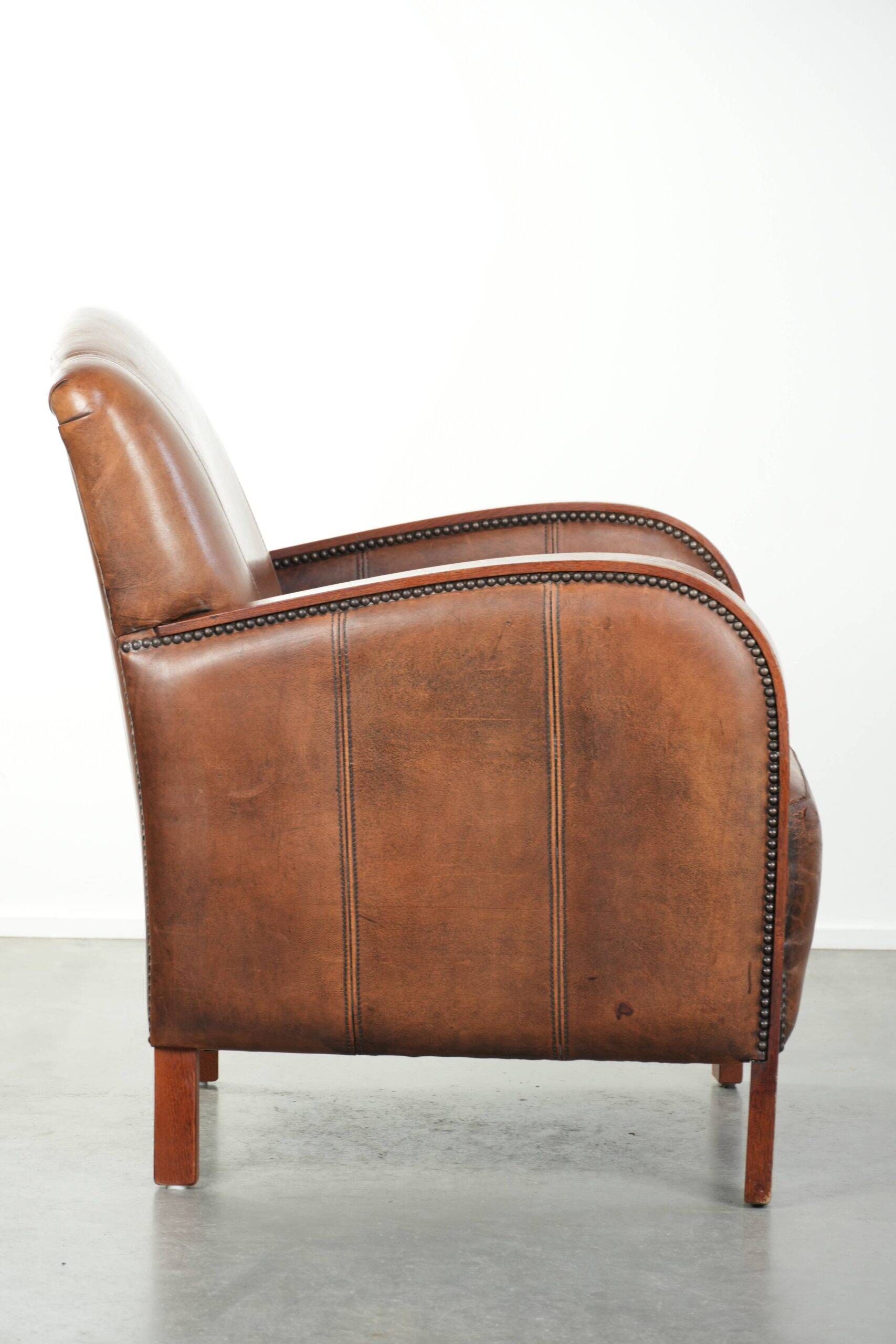Sheepskin armchair in Art Deco style with wooden armrests