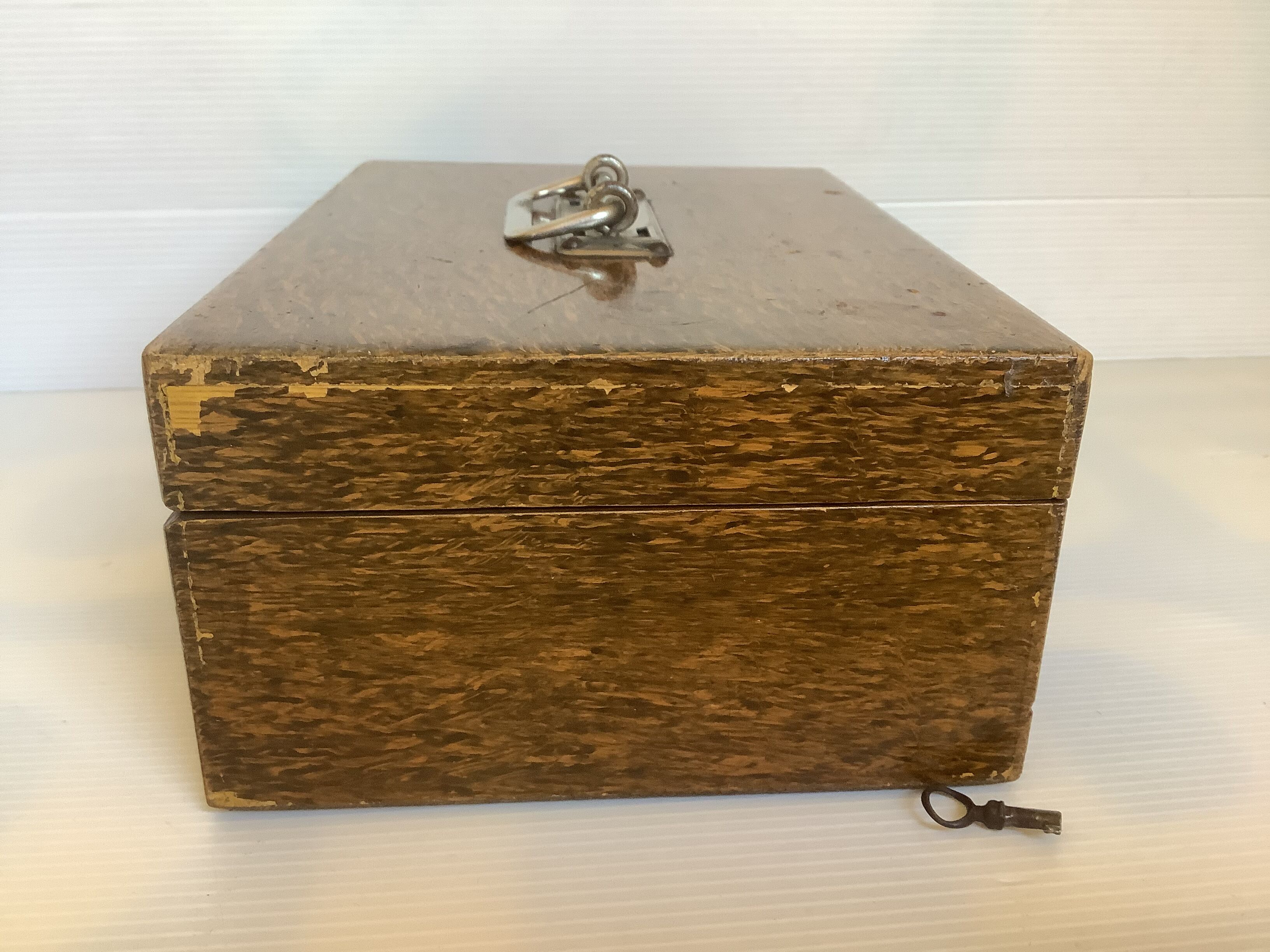 Old wooden box with handle and metal keys
