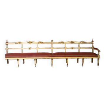 Carved wooden bench, gilded and painted, Italy around 1880, 510cm long.