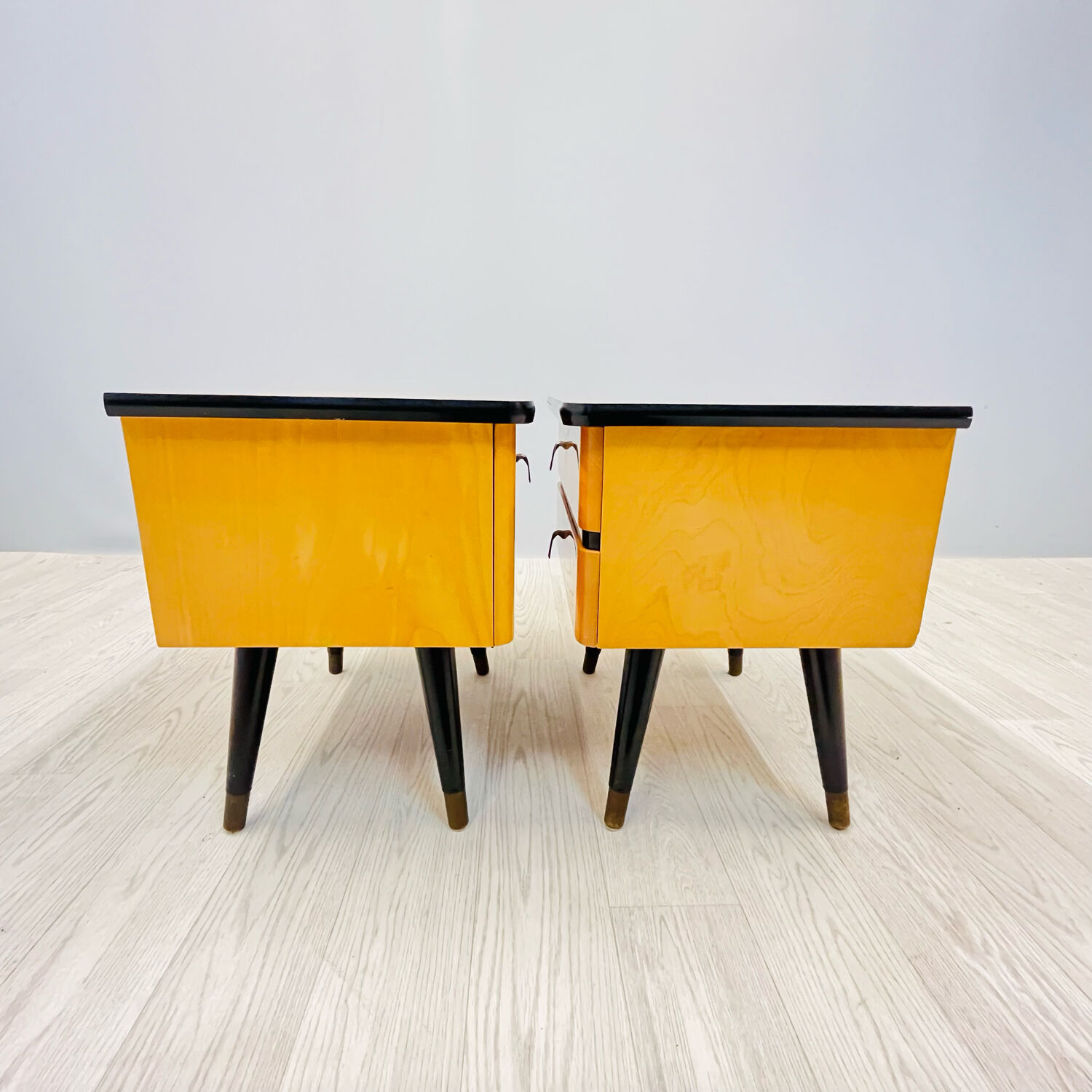 A pair of night cabinets