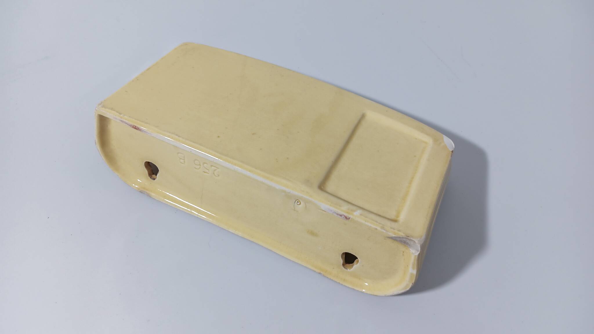Pale yellow ceramic soap dish
