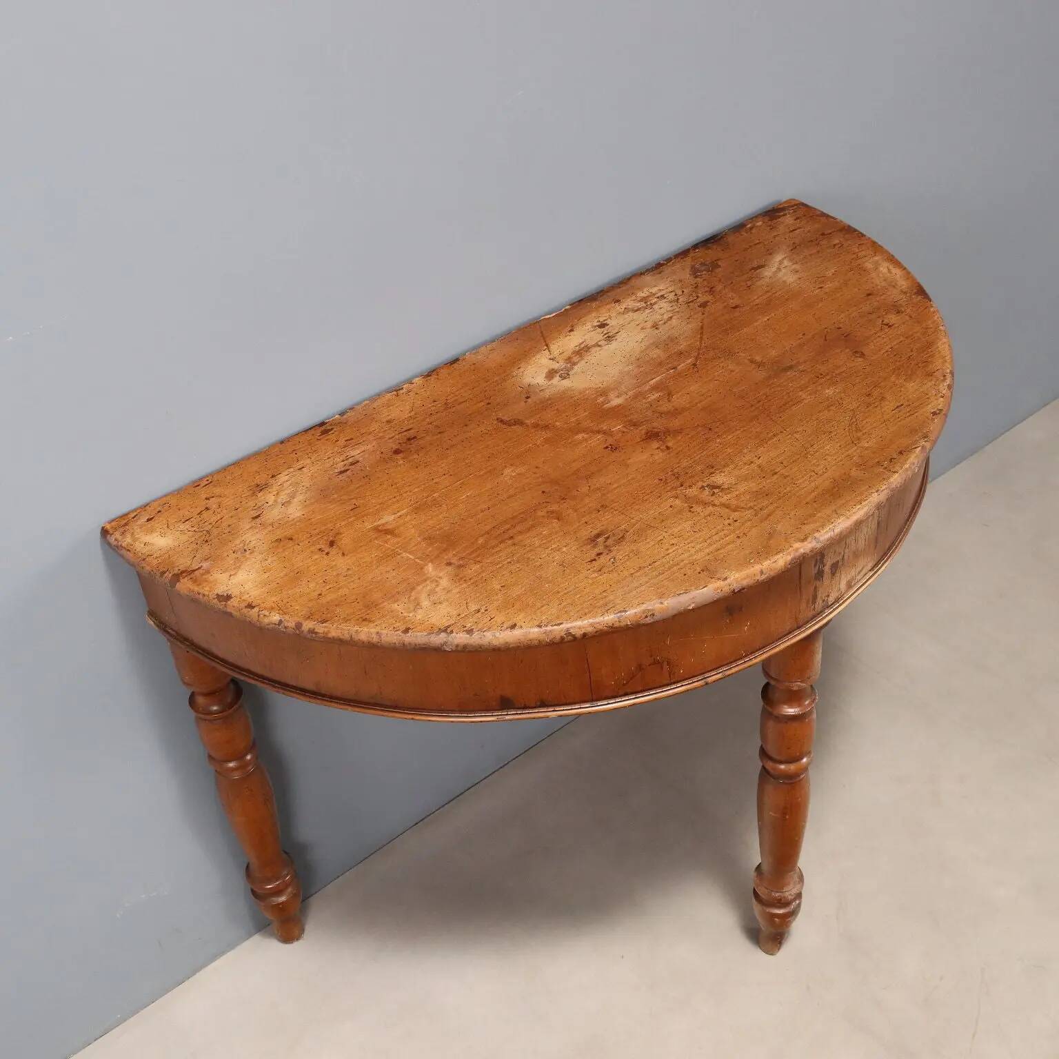 Antique walnut console with a half-moon top, Italy, 19th century.