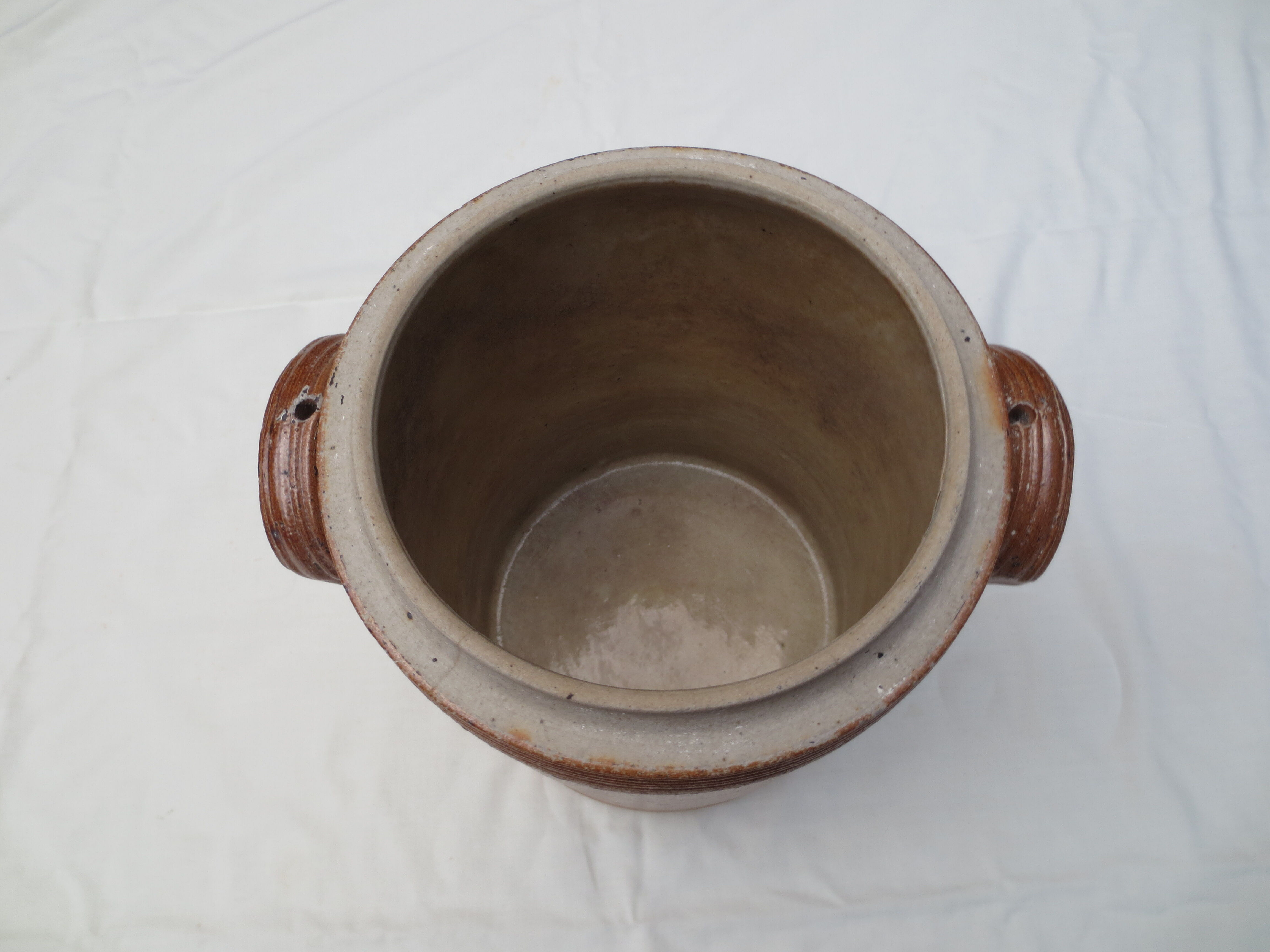 Old butter jug in flaming sandies