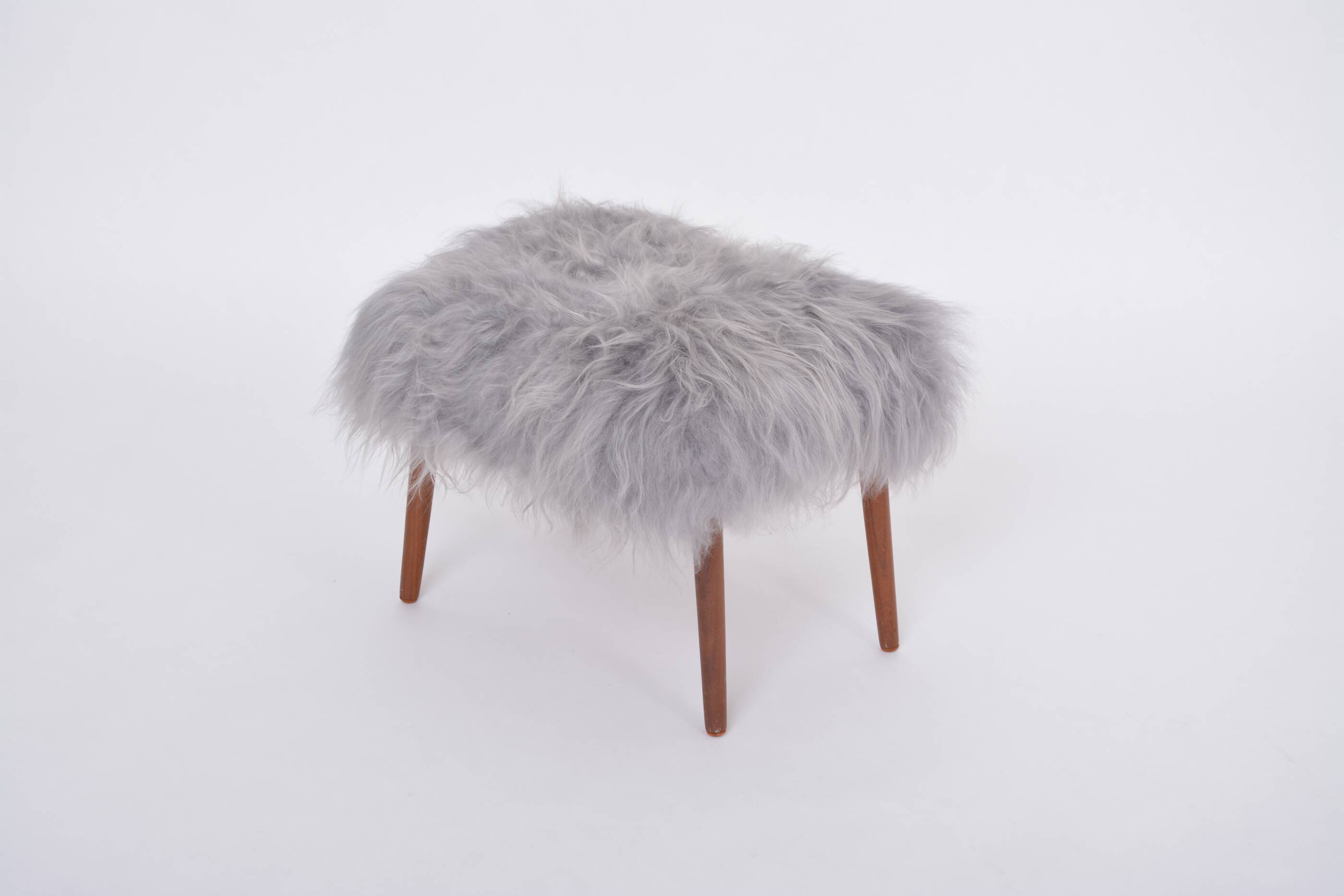 Danish Mid-century Modern stool reupholstered in grey sheep skin