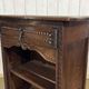 Oak accent furniture bookshelf with a drawer, early 20th century work.