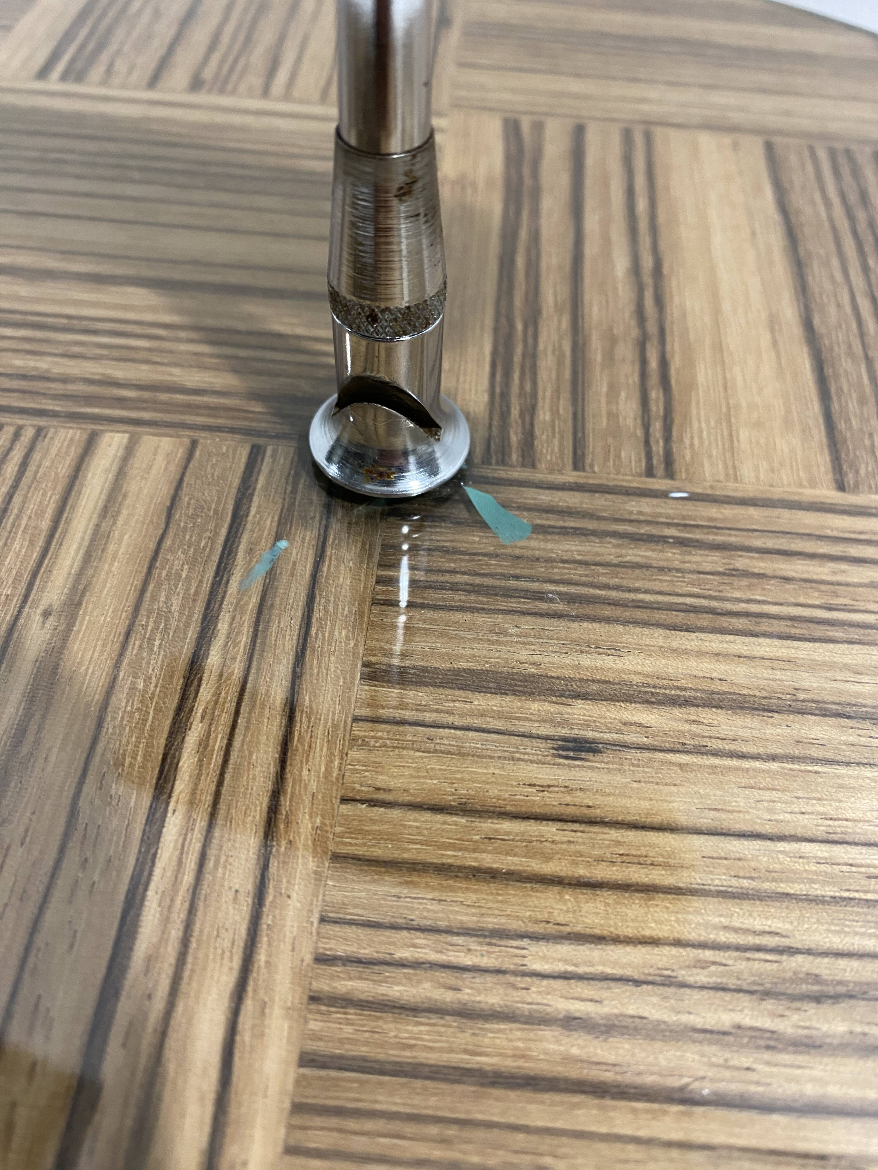 Vintage round wooden cheese board covered with glass plate with foldable handle