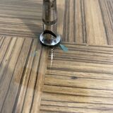 Vintage round wooden cheese board covered with glass plate with foldable handle