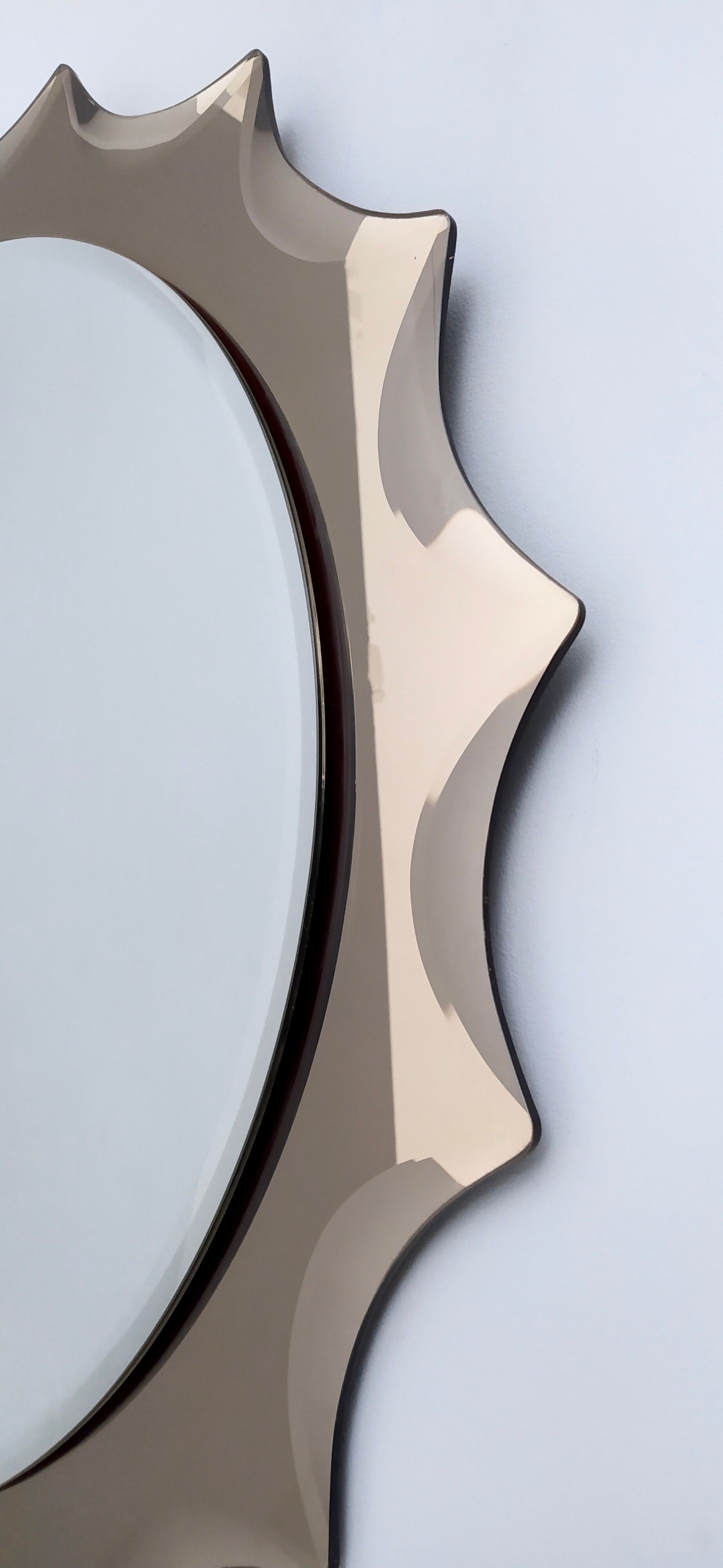 Postmodern sun shaped bronze wall mirror, italy