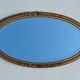 Miroir ovale en bois doré, style Louis XVI