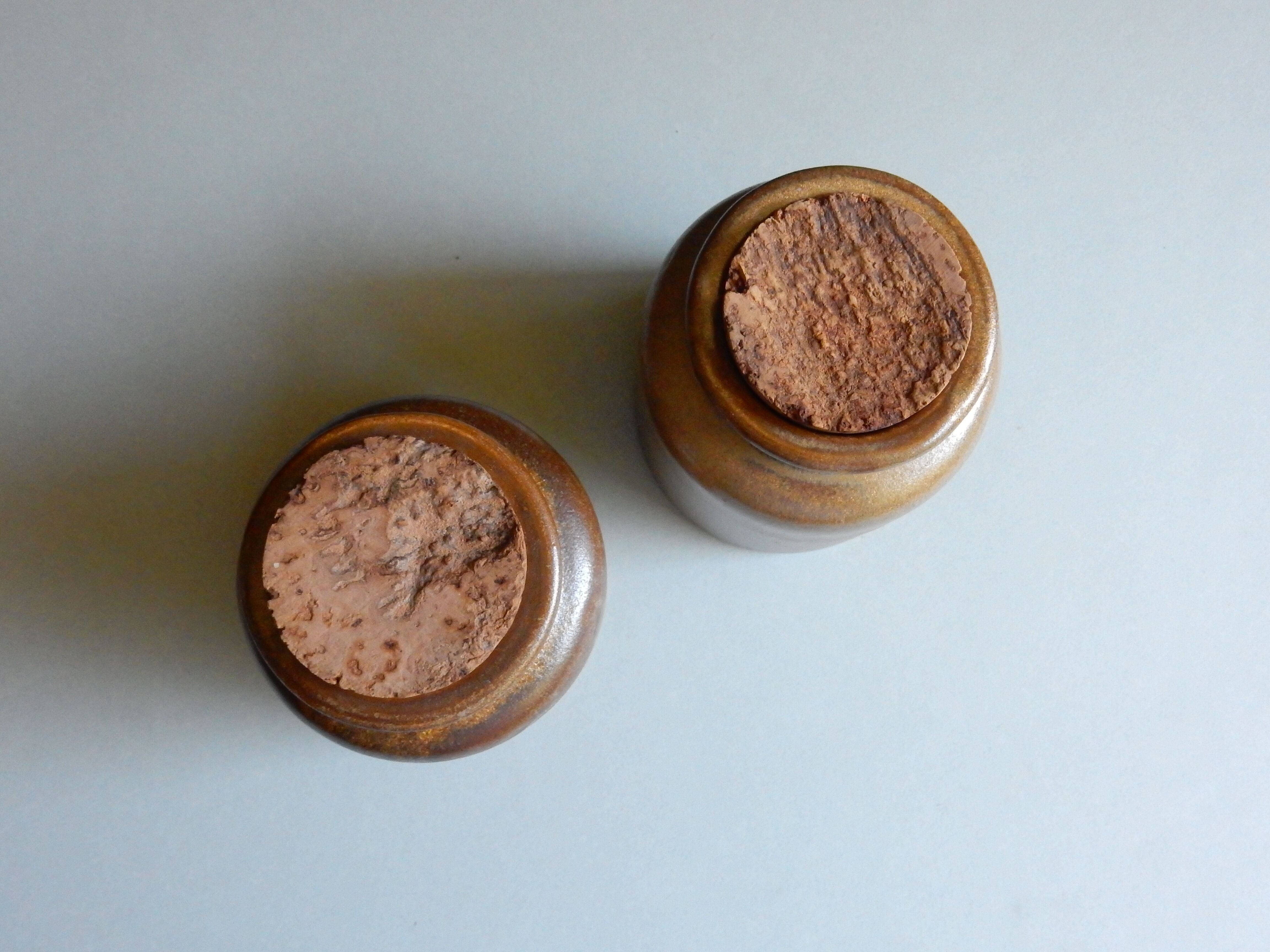 2 brown sandstone mustard pots