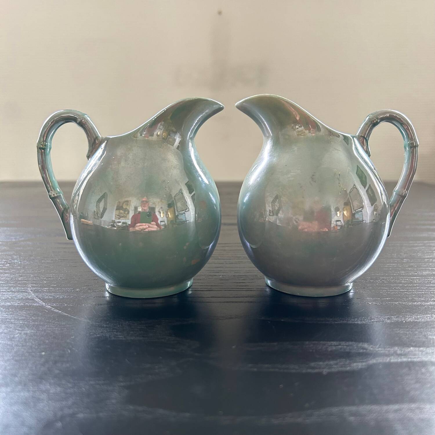 Pair of iridescent blue pitchers