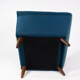 Armchair upholstered with dark blue wool fabric and legs in dark wood, of danish design, 1960s