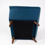 Armchair upholstered with dark blue wool fabric and legs in dark wood, of danish design, 1960s