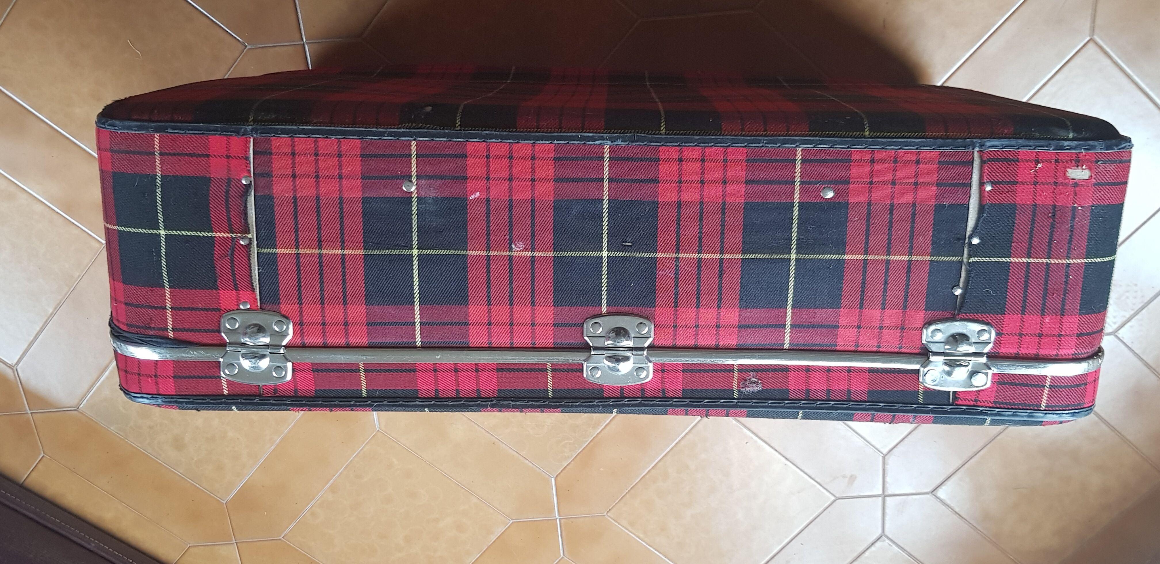 Vintage suitcase covered with scottish fabrics