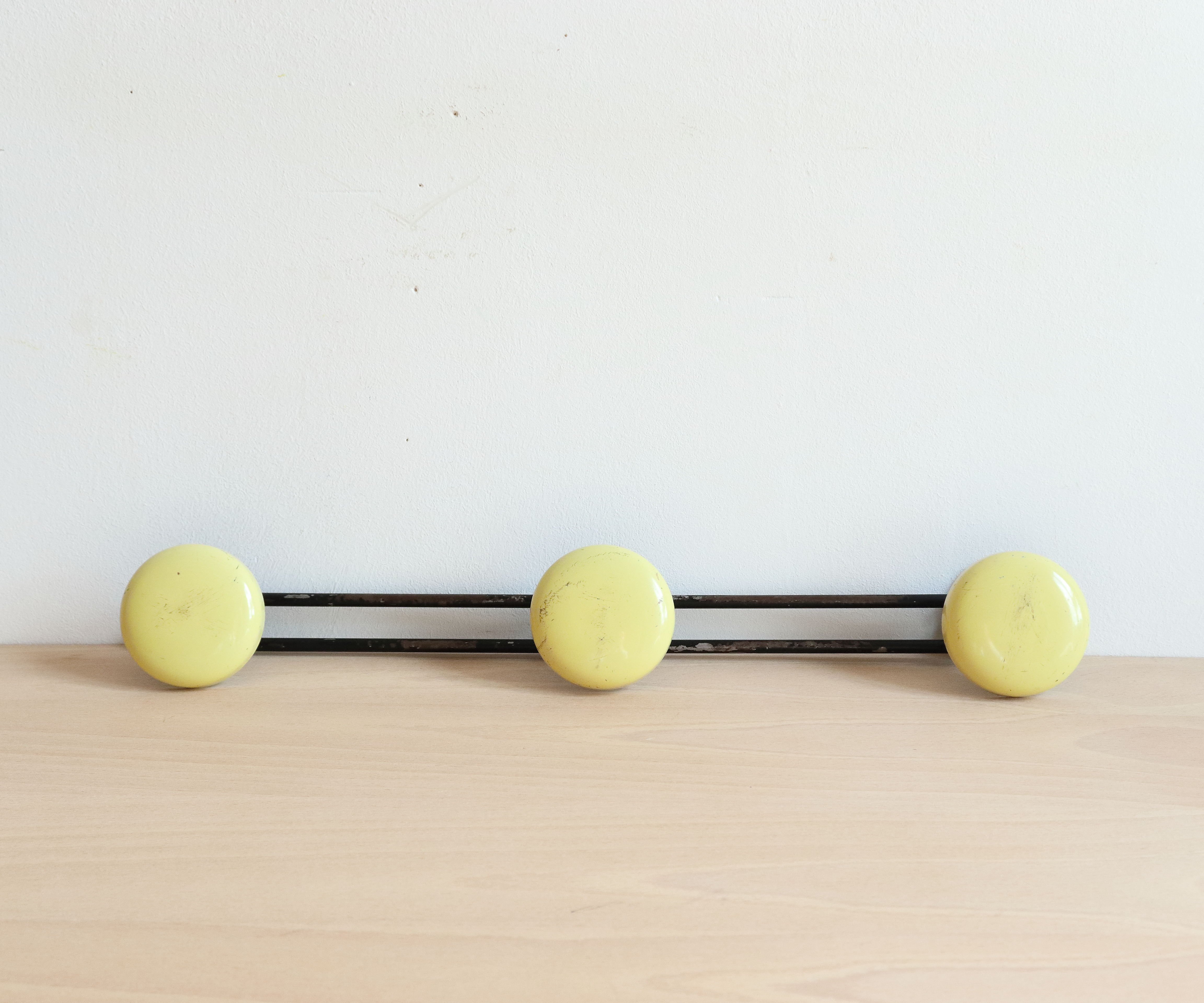 Wall doorpiece three black metal and yellow sheet metal