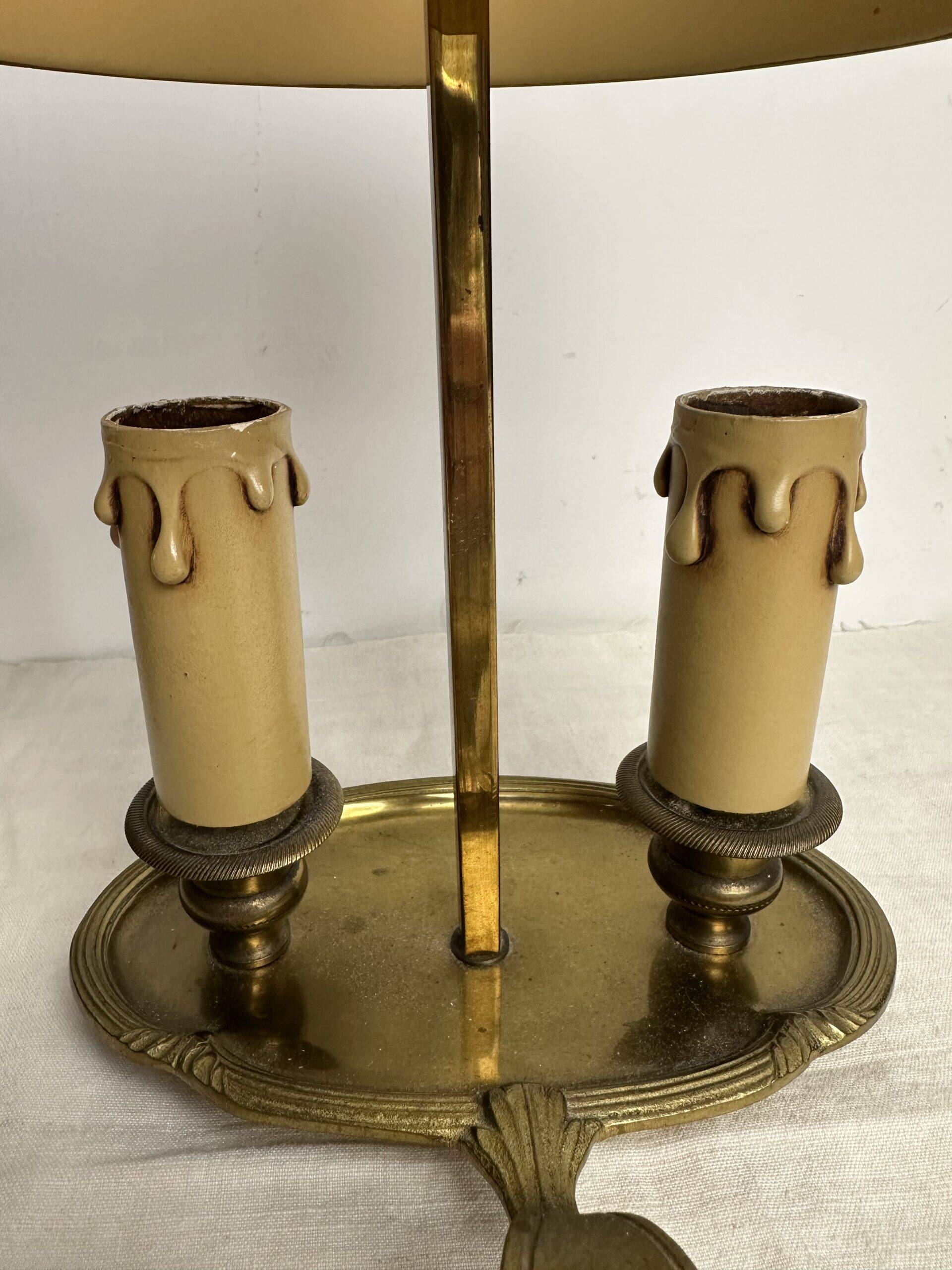 A pair of old brass bed warmers.