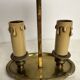 A pair of old brass bed warmers.