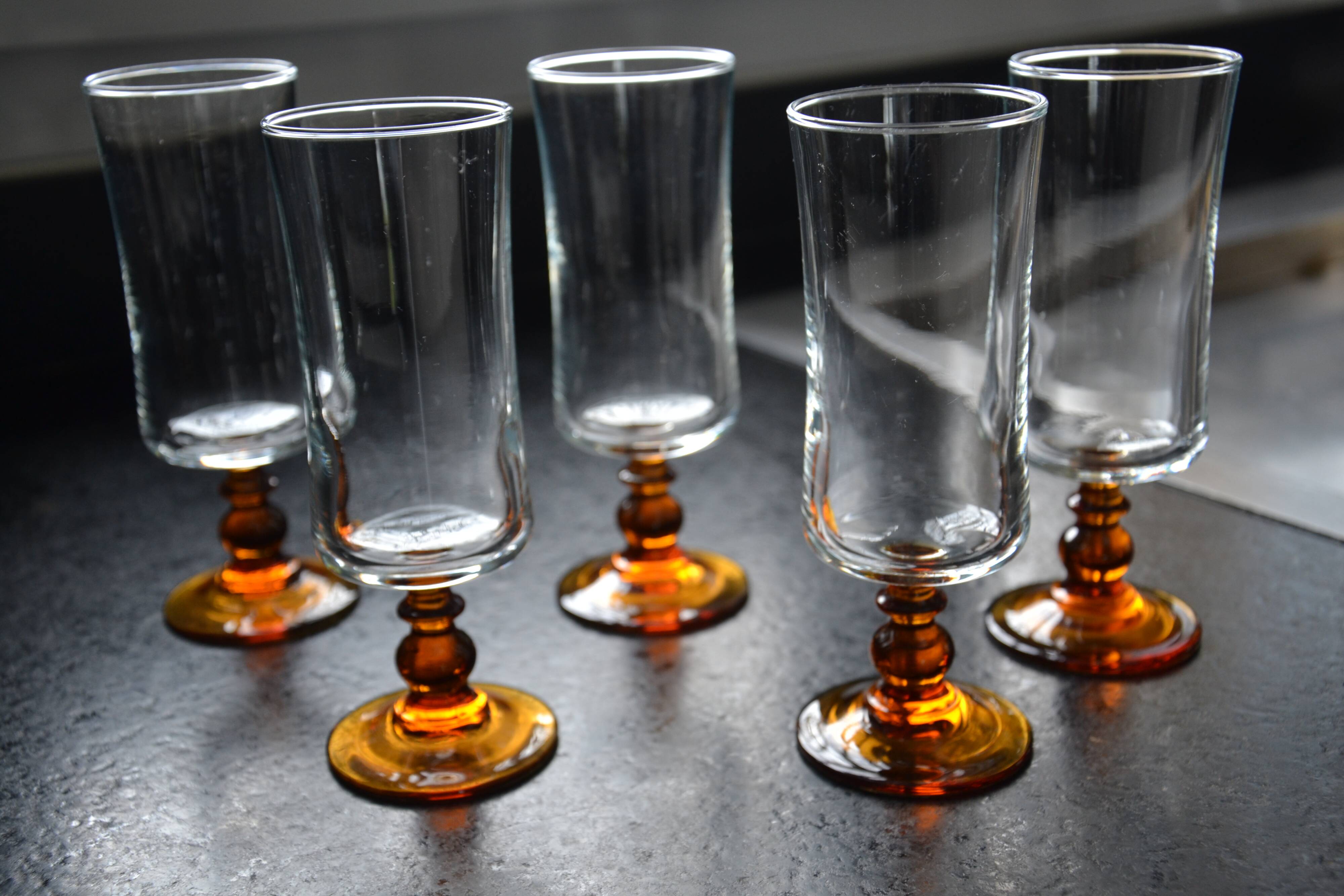 Champagne glasses with amber stems