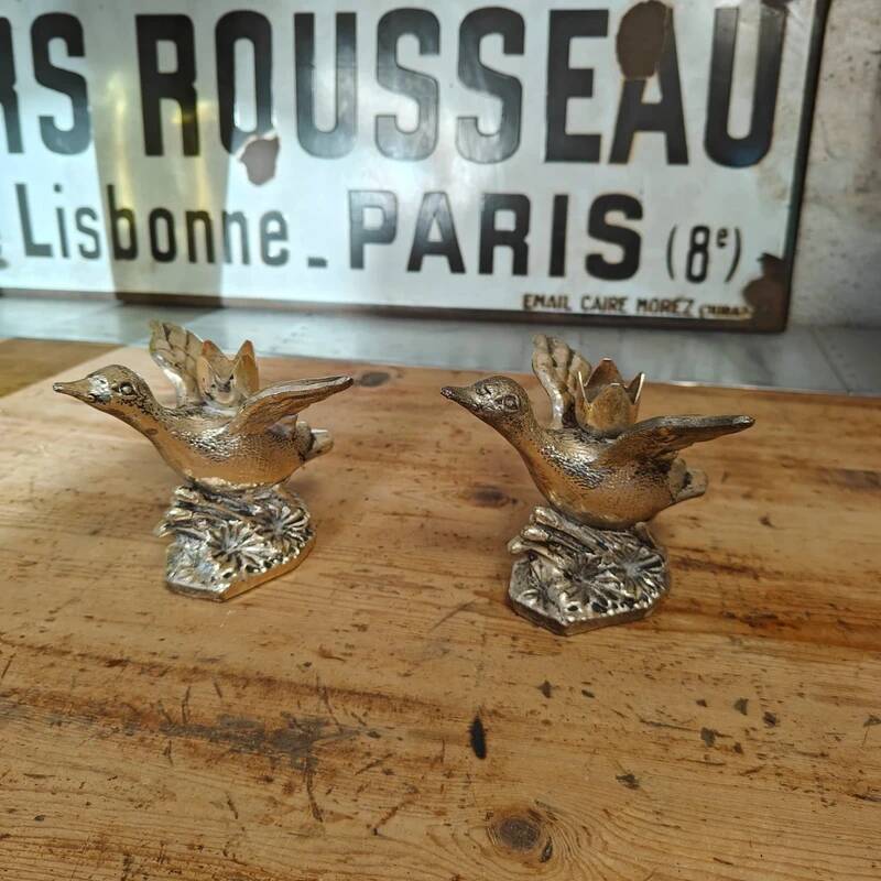 Set of two antique silver-plated duck candlesticks.