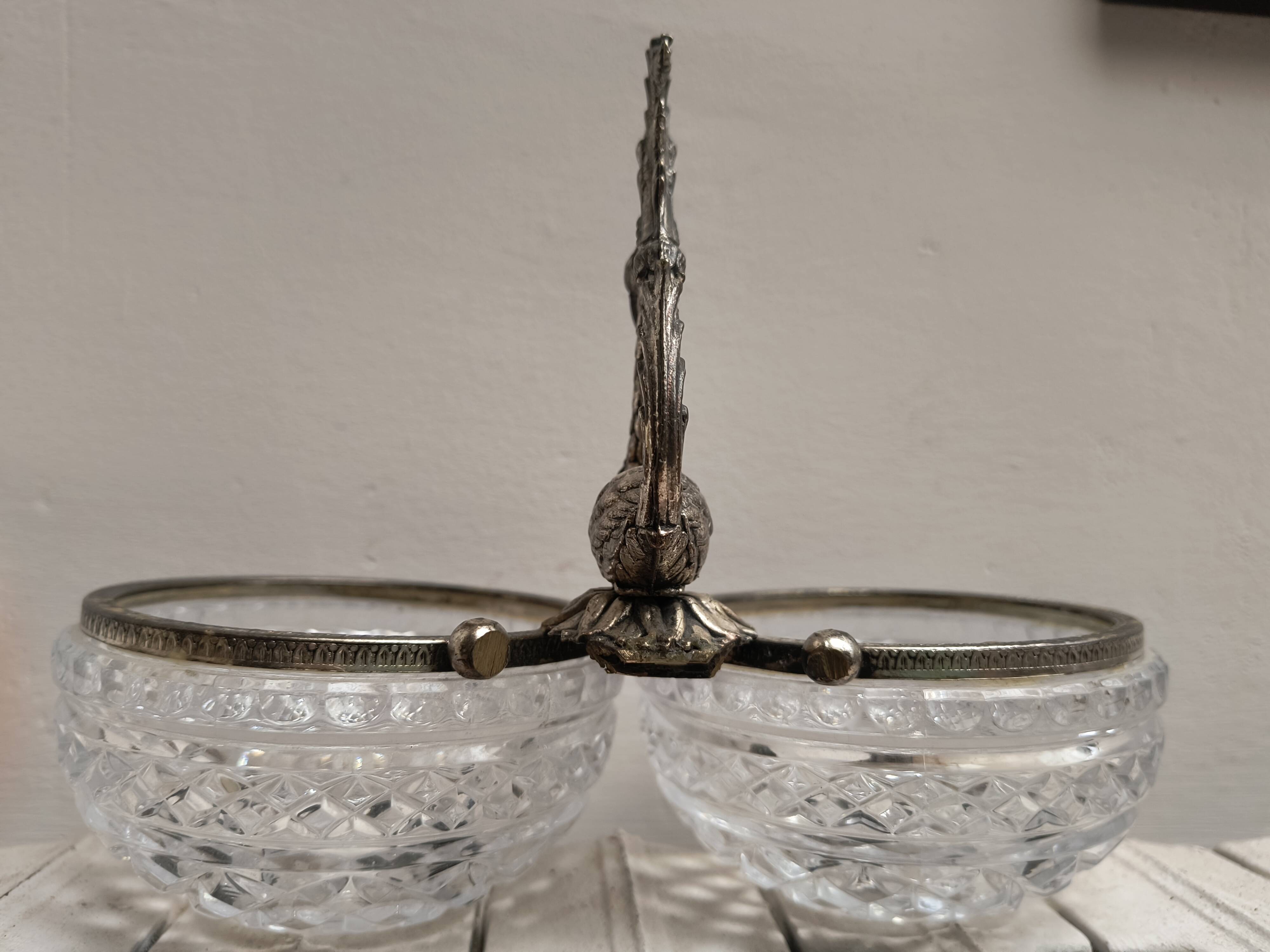 Crystal bowls joined by "swan neck" creation.