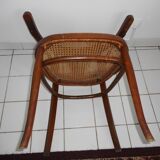 Wooden armchair with caned base