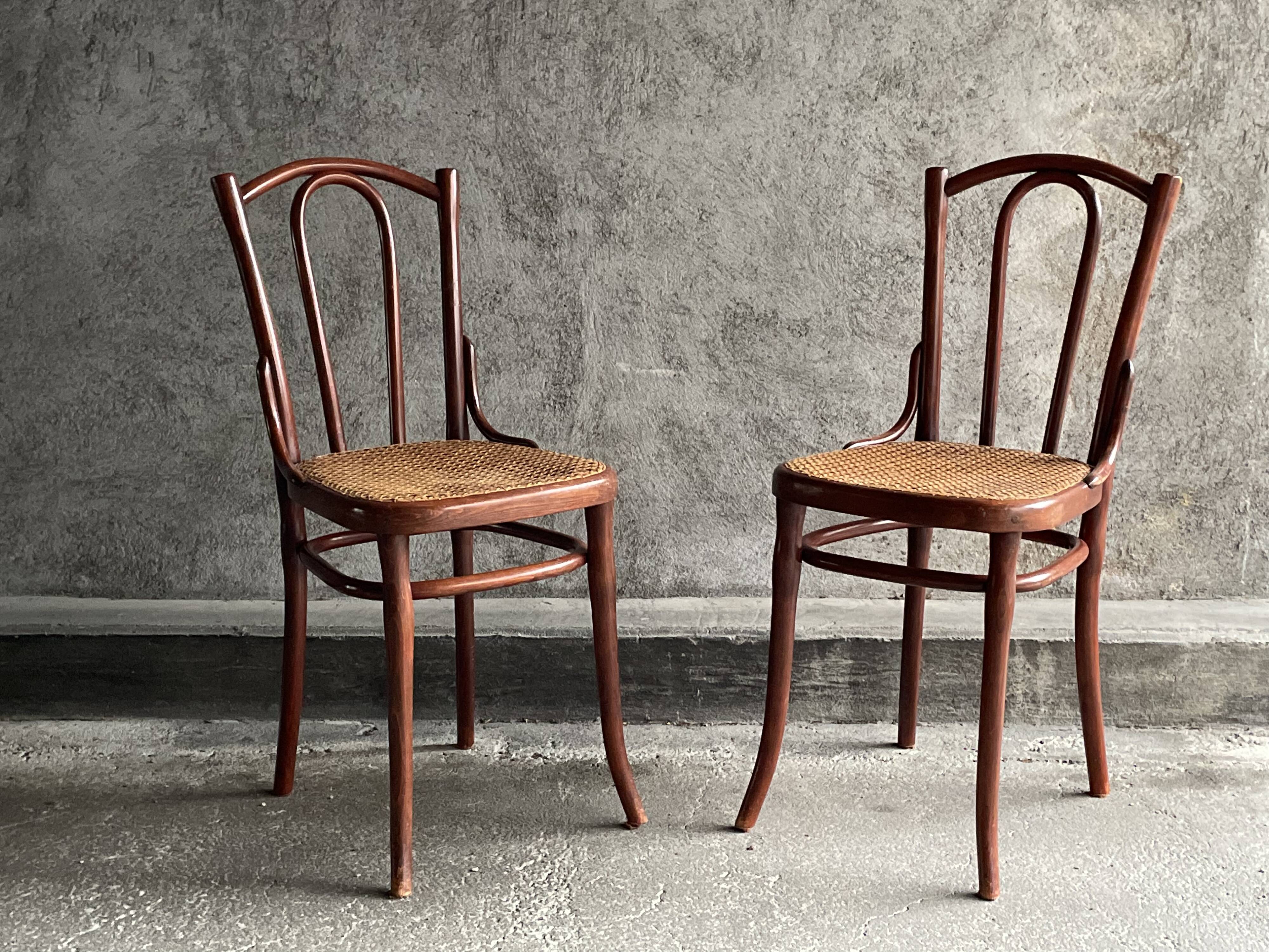 Pair of caned bistro chairs by Thonet