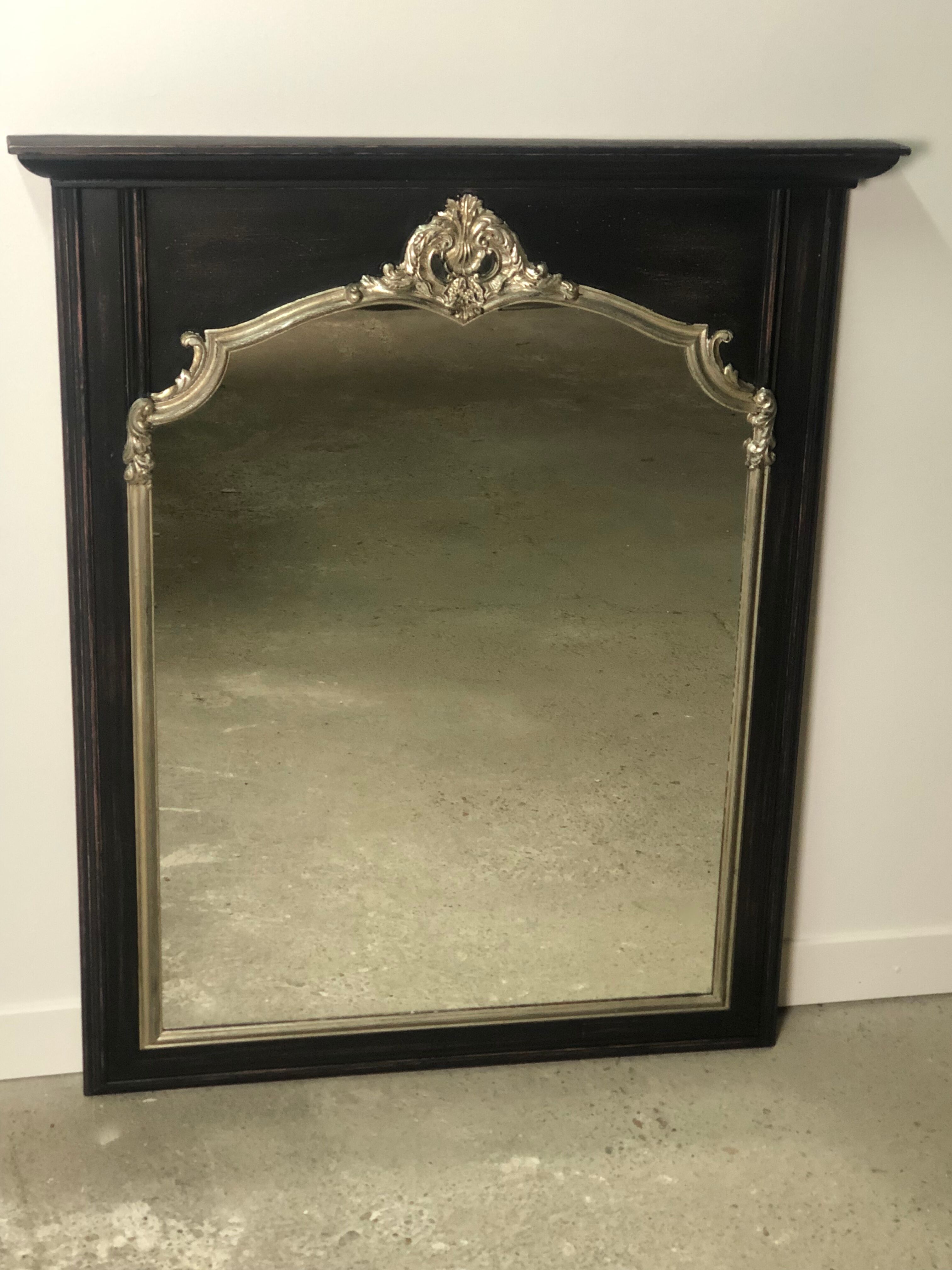 Trumeau mirror in black and silver patinated wood in Louis XV style