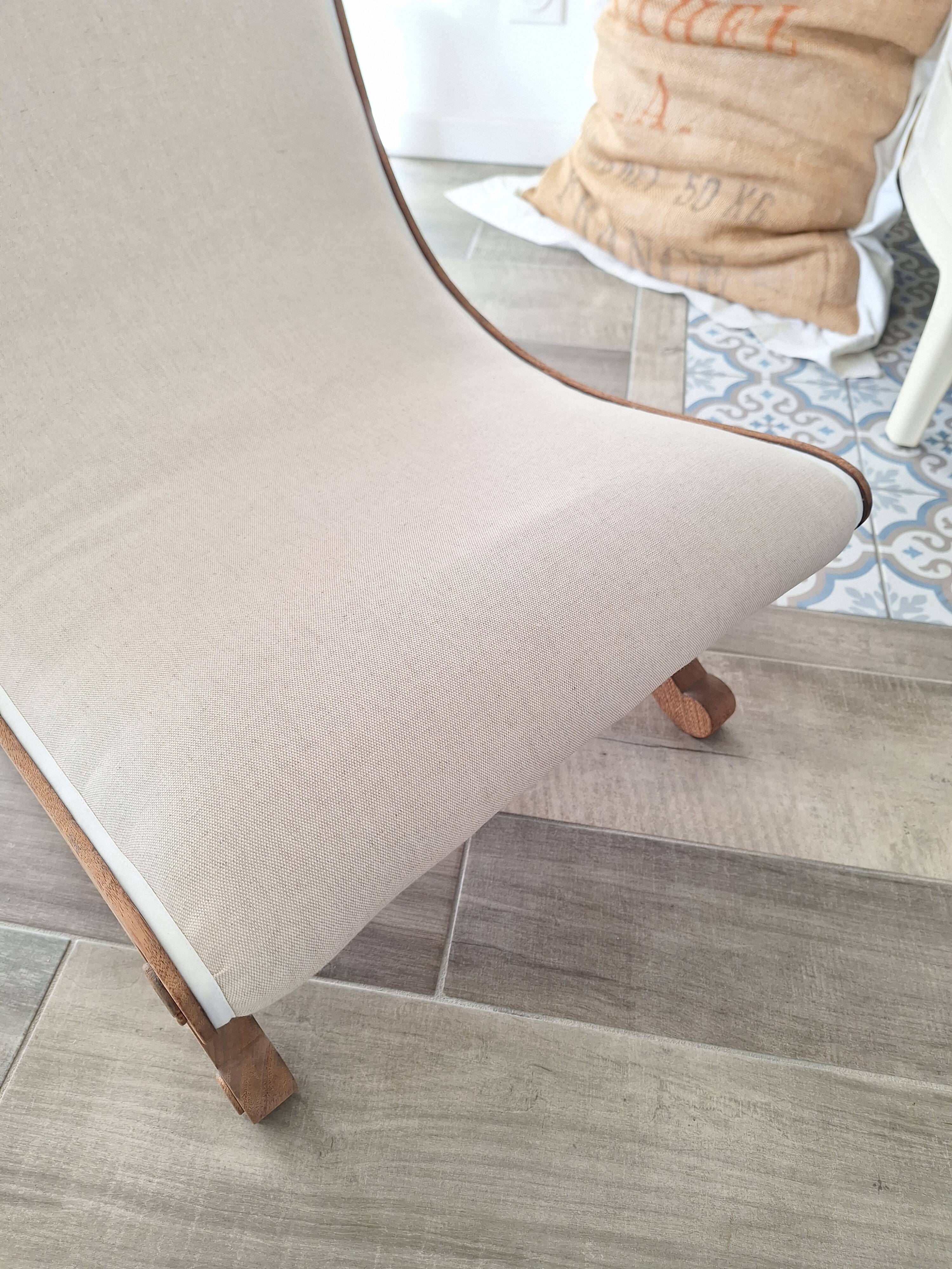 Vintage gondola armchair in beige linen fabric.