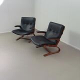 2 x Scandinavian black leather lounge chairs