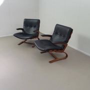 2 x Scandinavian black leather lounge chairs