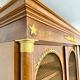Large Empire-style library in wood with gilded bronze ornaments.