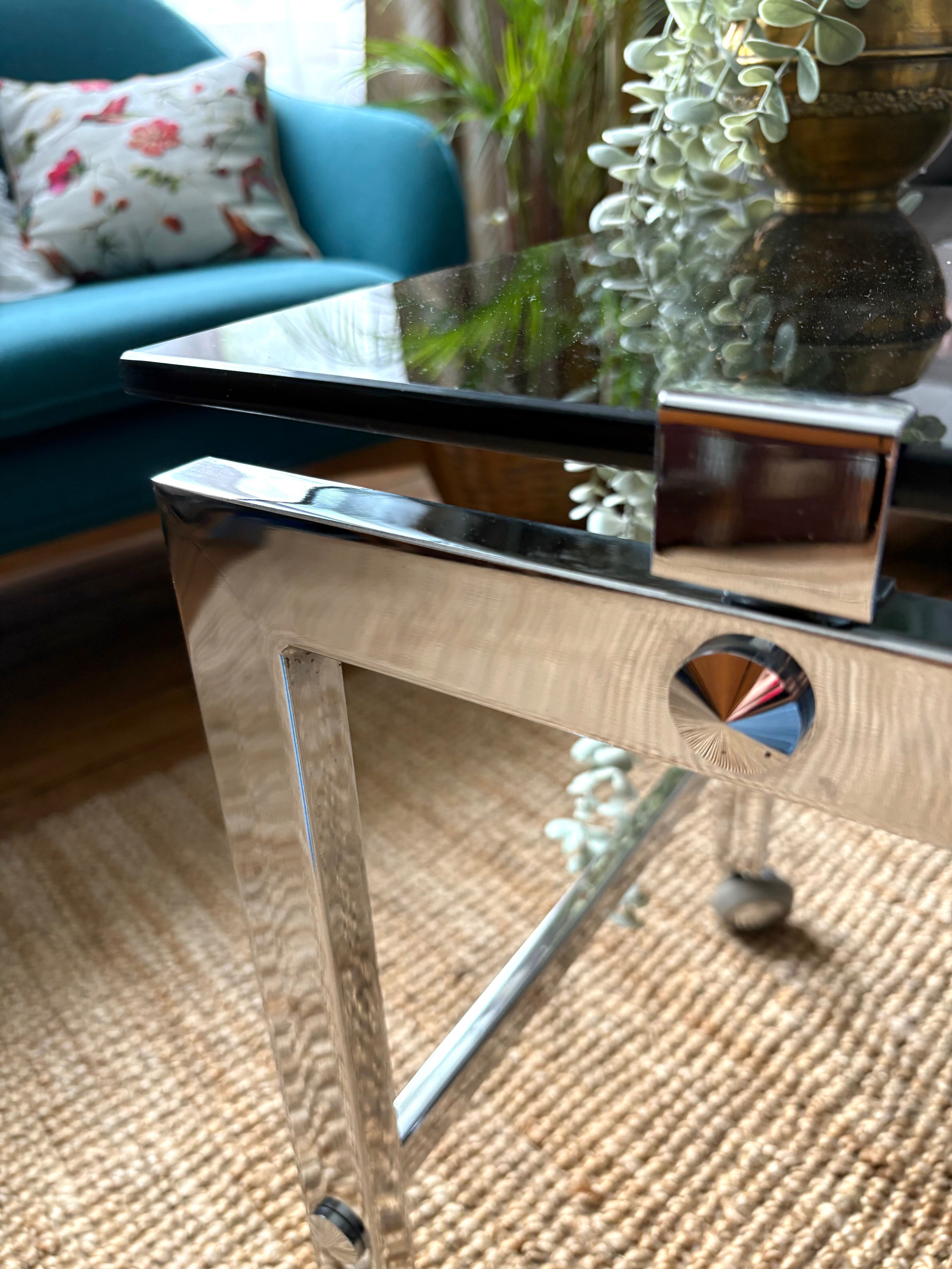 Chrome and smoked glass coffee table on wheels 1970