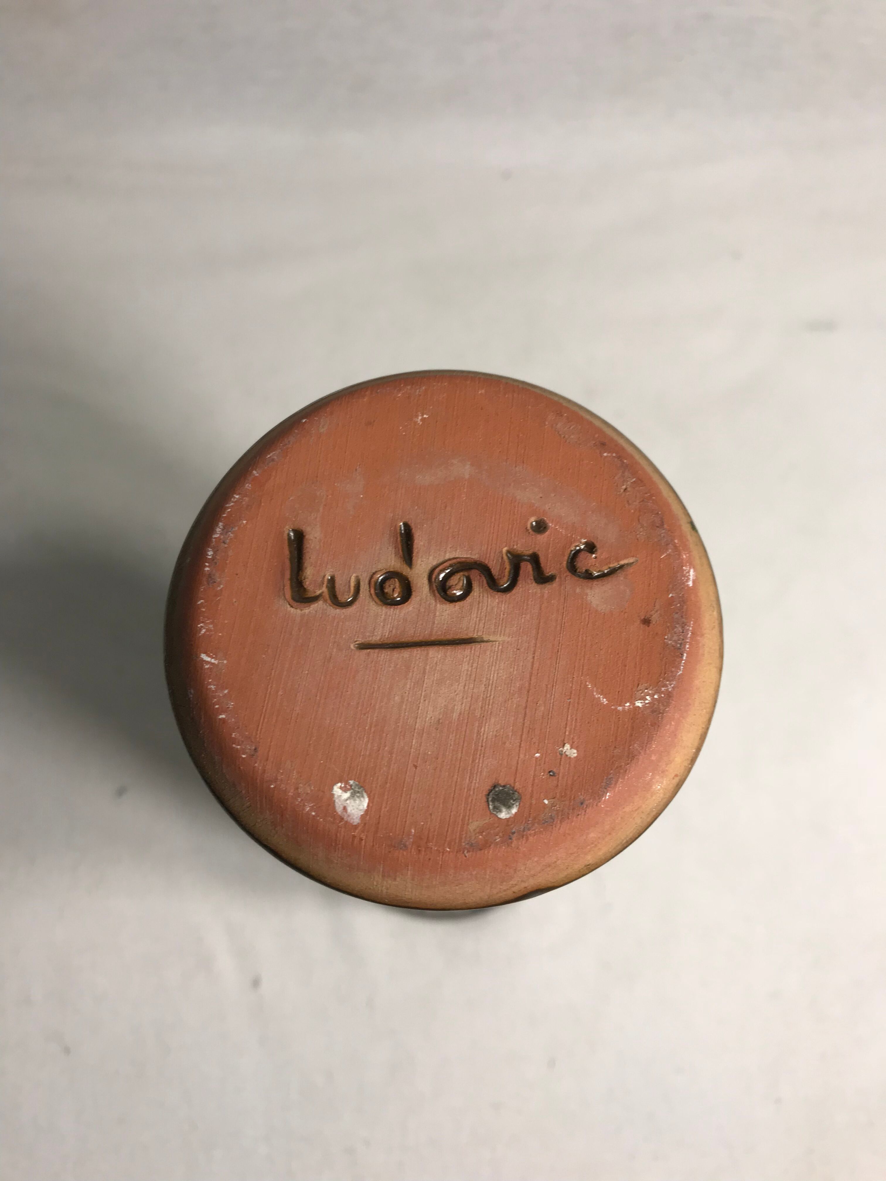 Roll former enamelled terracotta vase signed Ludovic