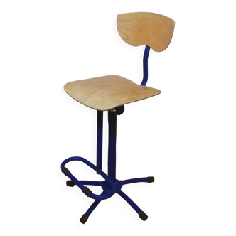 Adjustable industrial chair with footrest