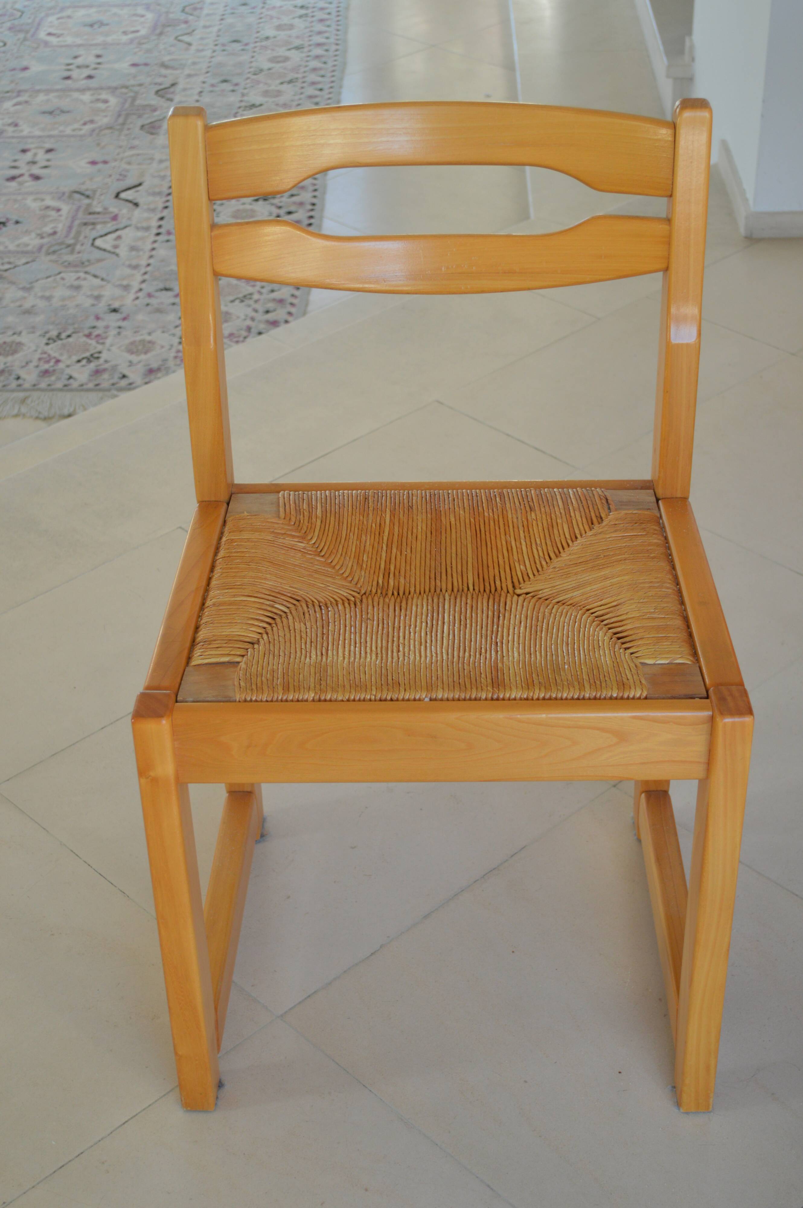 Chair made of solid elm, with a straw seat.