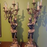 Paire de nubiens porte torchère en bois doré baroque