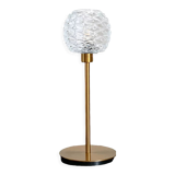 Table lamp with an antique glass lampshade and a gilded foot