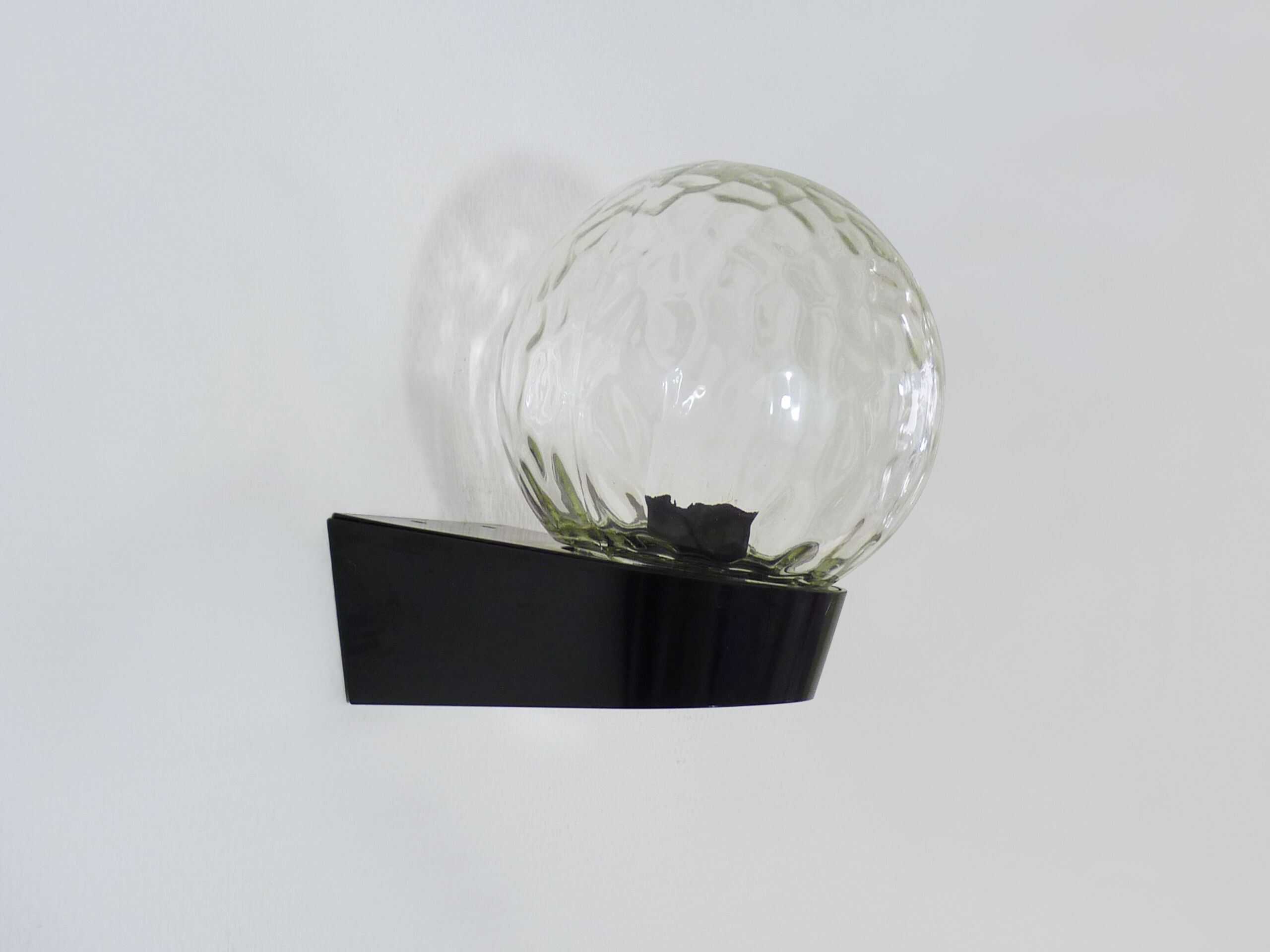 Vintage wall light plastic or bakelite structure, transparent glass globe. Year 70