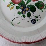 Old earthenware plate of the East Strasbourg decorated with flowers